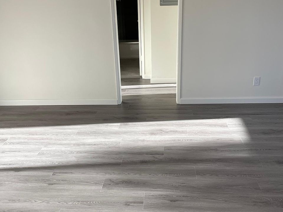 Living area and hallway to full bathroom and bedroom