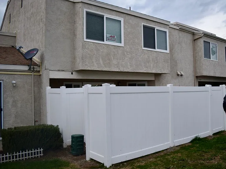 View of the townhouse from grassy area. Bedroom 3 on left upstairs and master on right.