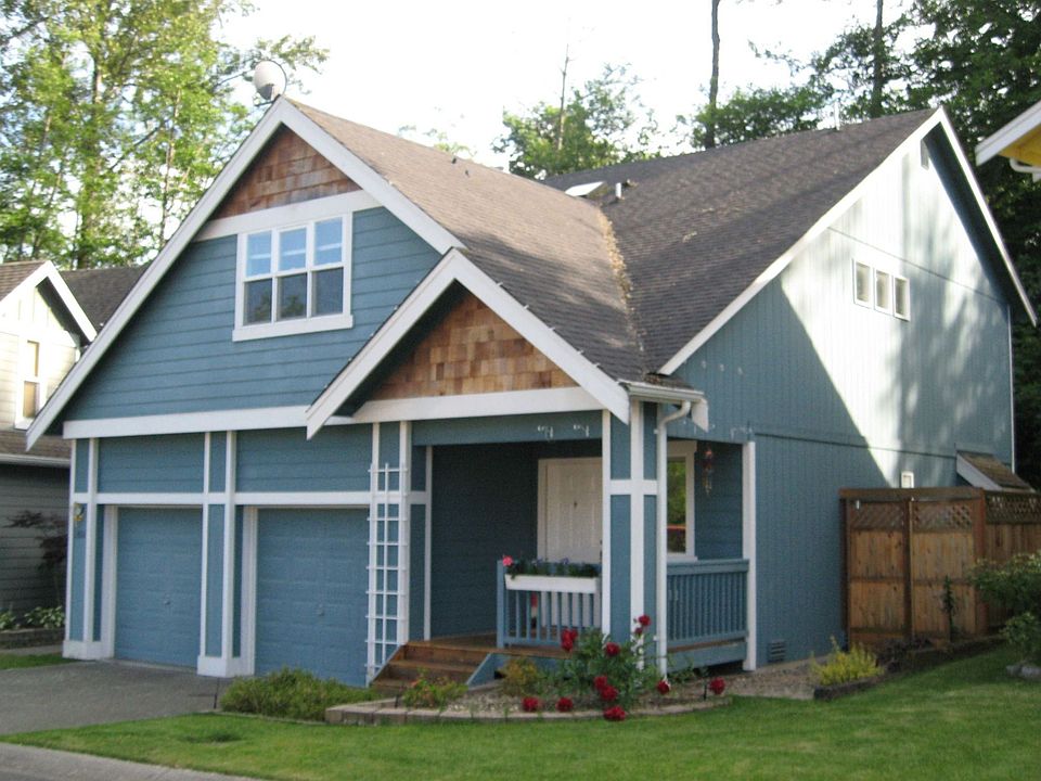 Landscaped with Irrigation. Nice porch.  HOA mows lawn.