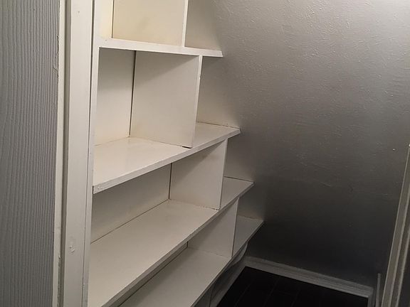 Huge walk-in pantry under stairs