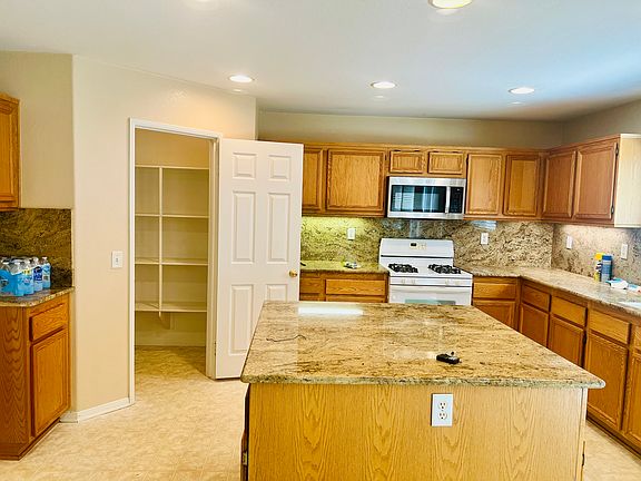 Kitchen with view of large walk in pantry