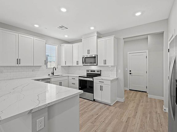 This kitchen comes with stainless-steel appliances.