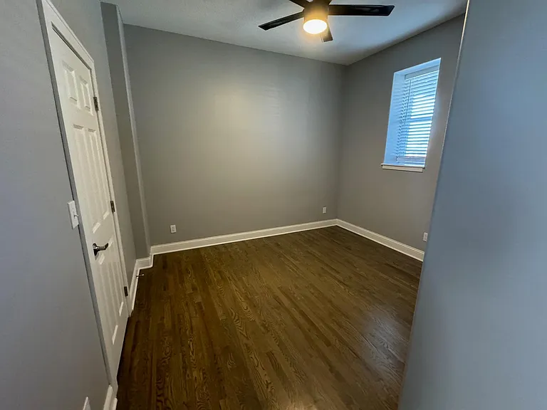 Bedroom features cieling fans to enjoy spring and fall in KC.