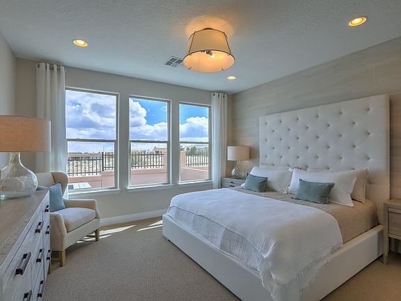 The owner s suite is shown with a tile decorative wall, fun lighting fixture and a private full bath