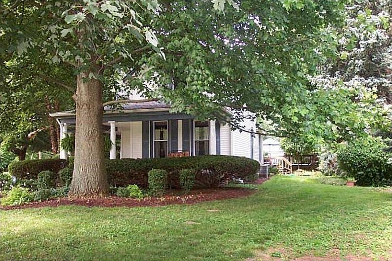 Exterior Front. Almost and Acre, Historical 1800 s Home. Home is built with double brick wall construction. Location close to downtown, schools and shopping.