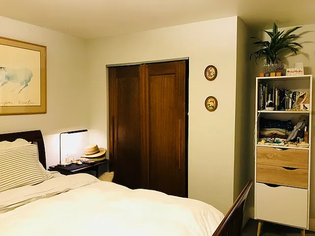 Bedroom with a previous tenant's furnishings