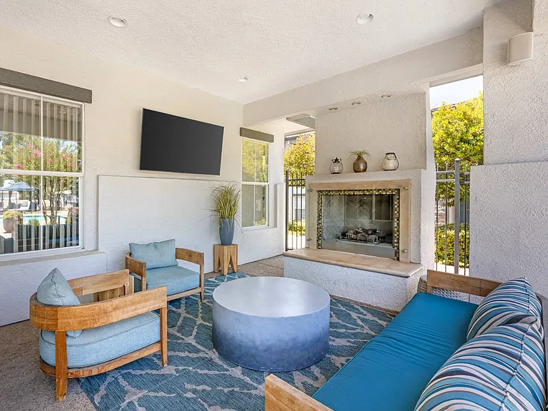 Our scenic pool deck features a large pool, jacuzzi, two propane grills, plenty of seating, and a covered lounge with a cozy fire pitperfect for year-round relaxation at Ascent at the Galleria.
