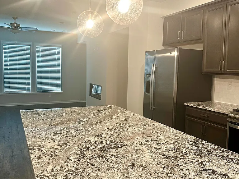 Large kitchen island with Silestone_ Granite countertops