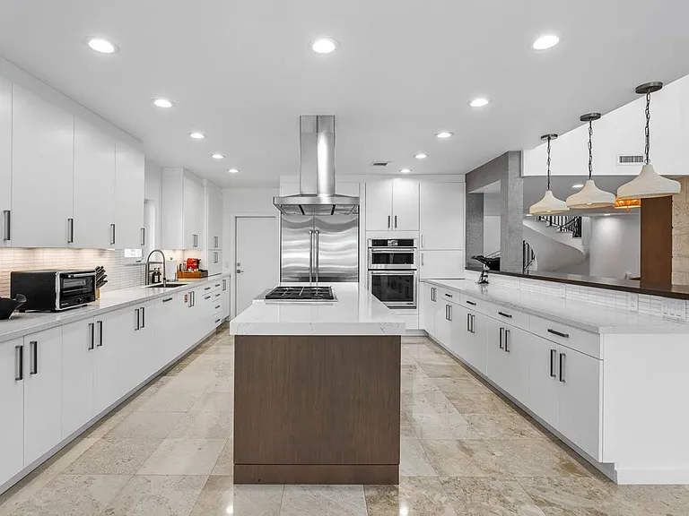 The ultimate chef's kitchen with high-end stainless steel appliances.