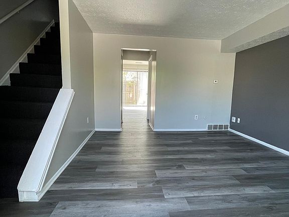 Hallway to Eat-in-Kitchen and Fenced-in Patio