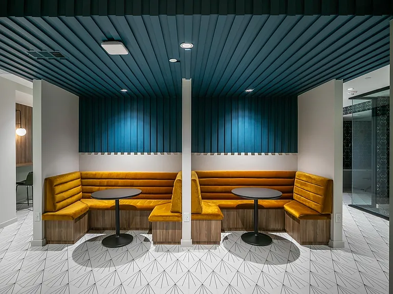 Find your ideal workspace at Modera EaDo's coworking lounge, where comfort meets productivity with lounge seating designed for collaborative success.