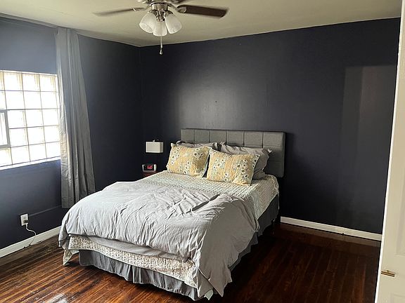 Large bedroom with natural lighting.