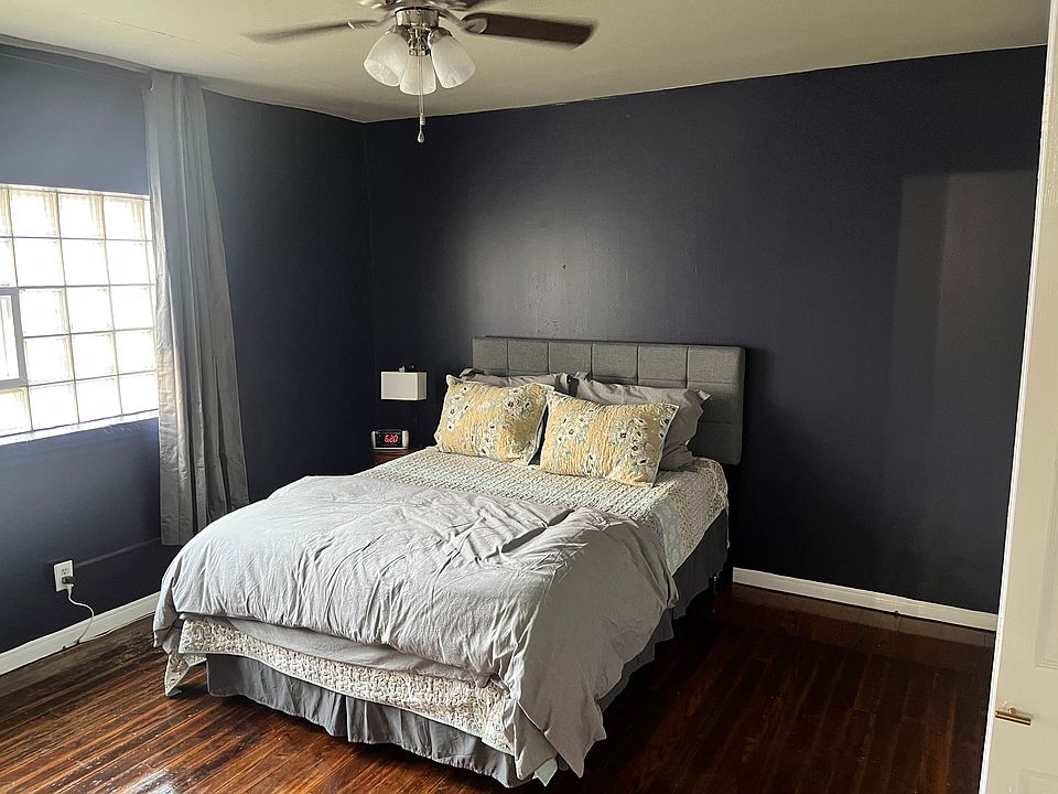 Large bedroom with natural lighting.