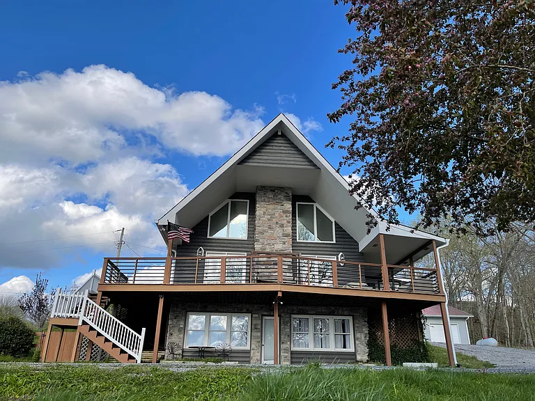Our A-Frame home faces the sunset as it sets over the 3-acre spring fed lake