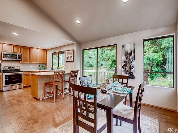 Light and bright updated kitchen with gorgeous quartz counters, engineered hardwood flooring and samsung stainless appliances
