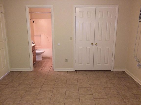 Bedroom looking toward bath and walk-in closet