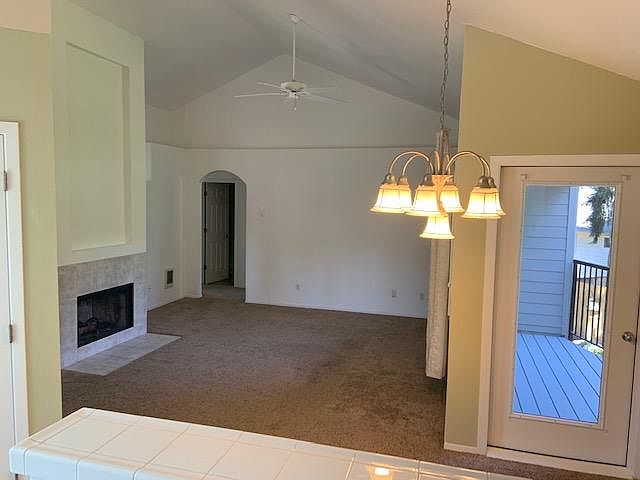 Living/family room with natural light and deck off dining area