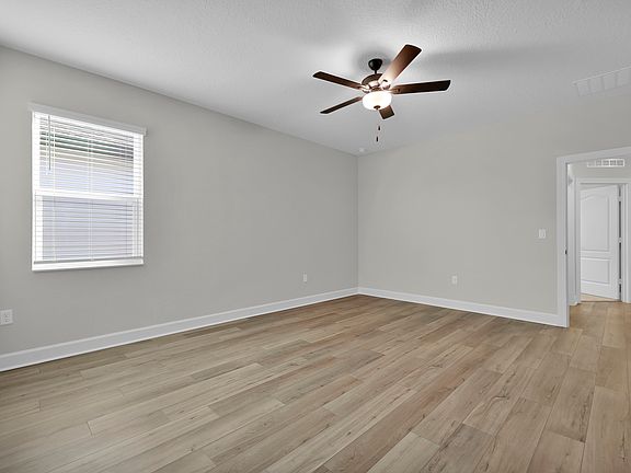 Rest and relaxation await in the master bedroom