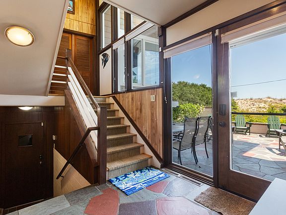 Entry hall and view of east patio and dunes