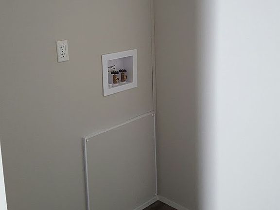 SEPARATE LAUNDRY ROOM WITH WASHER/DRYER HOOK-UPS.