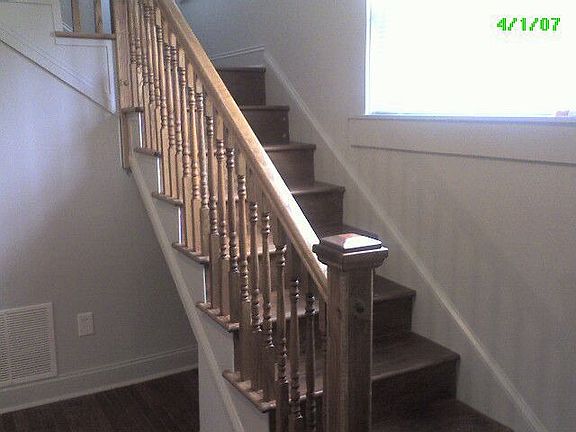 Stairwell in foyer to 2nd w gleeming hardwoods