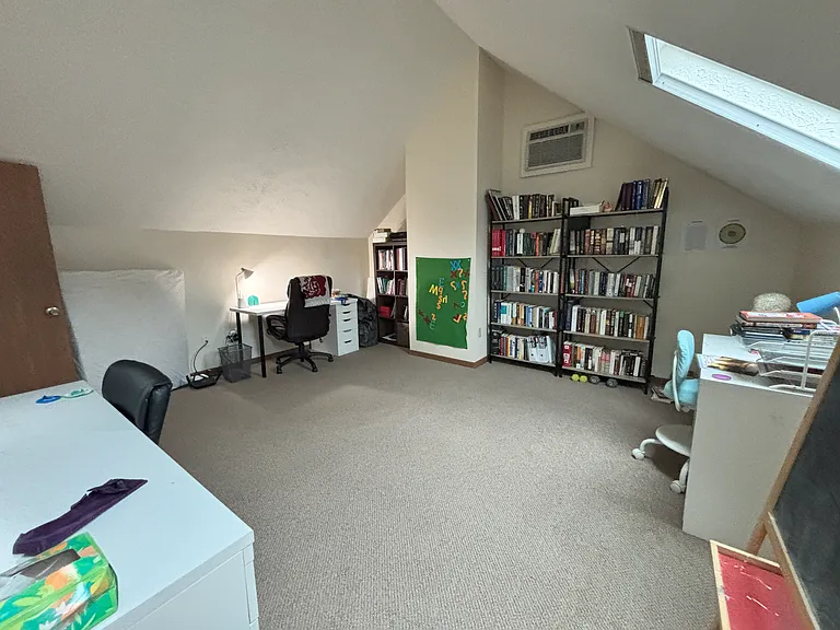 Huge loft/bedroom with closet, skylights and private AC unit.