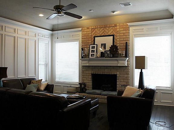 Nice inviting den with wood floors, fresh paint and fixtures