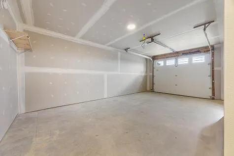 Attached, heated garage with ample space. 2 parking spaces in parking lot at unit. Paved parking.