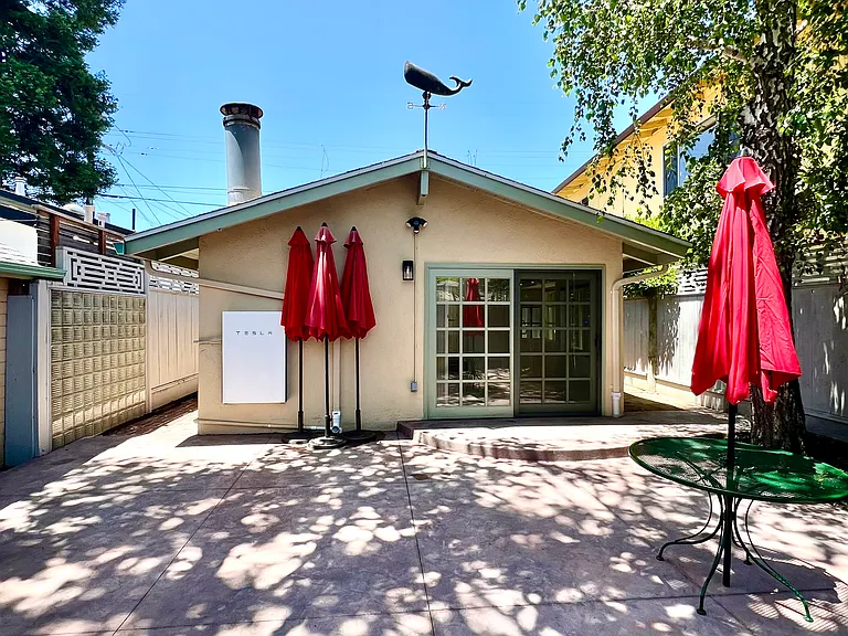 filtered light from trees in backyard, plenty of space for entertaining and enjoying the outdoors
