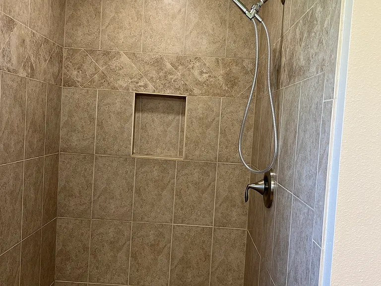 Walk-in shower in the Owner Suite