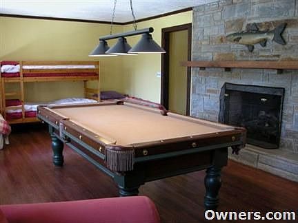 Downstairs great room with stone fireplace