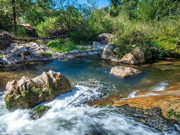 Natural rock waterfall in backyard