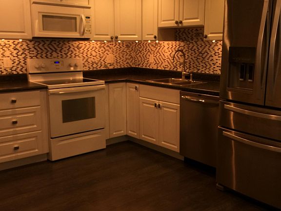 Kitchen with lots of cabinets and all appliances