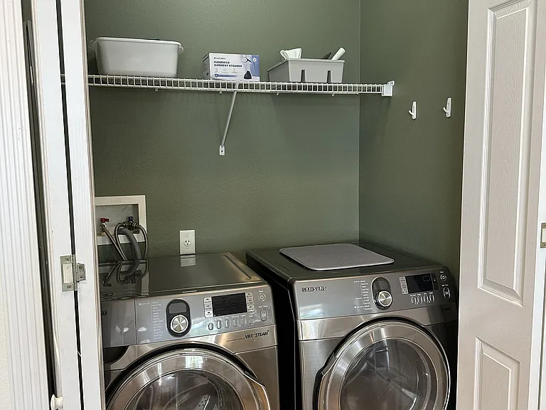 Laundry closet in kitchen/dining area