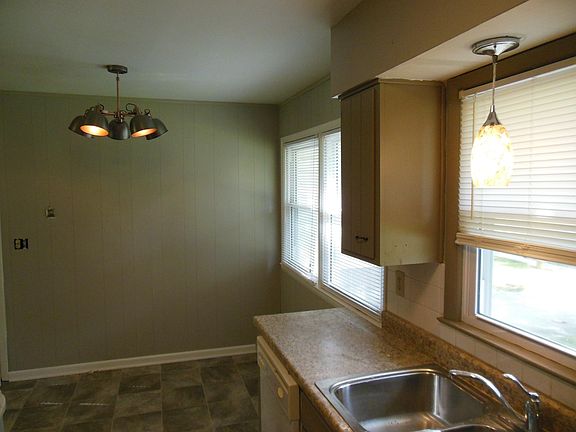 Beautiful kitchen with modern lighting, painted cabinets, new flooring