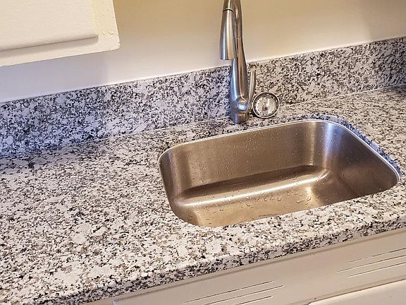New Granite Countertop, New Sink, and New Faucet