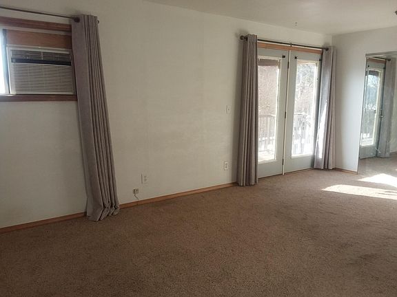 Master bedroom with a door out to the deck. This room also has two large closets.