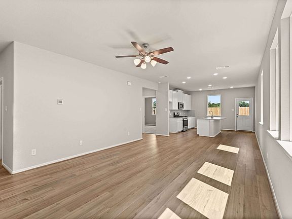The entryway leads you to a bright and light open concept living space