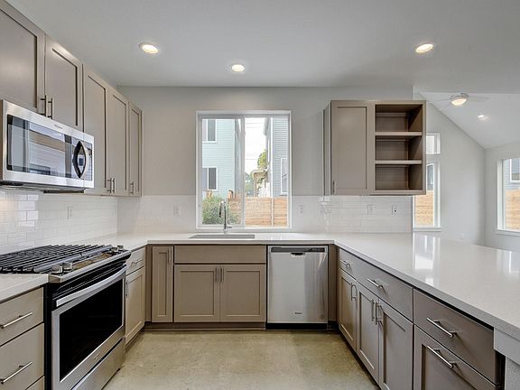 Kitchen with all new stainless steel appliances. Gas stove!
