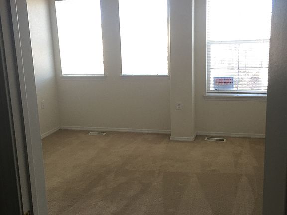 Open master bedroom with natural light