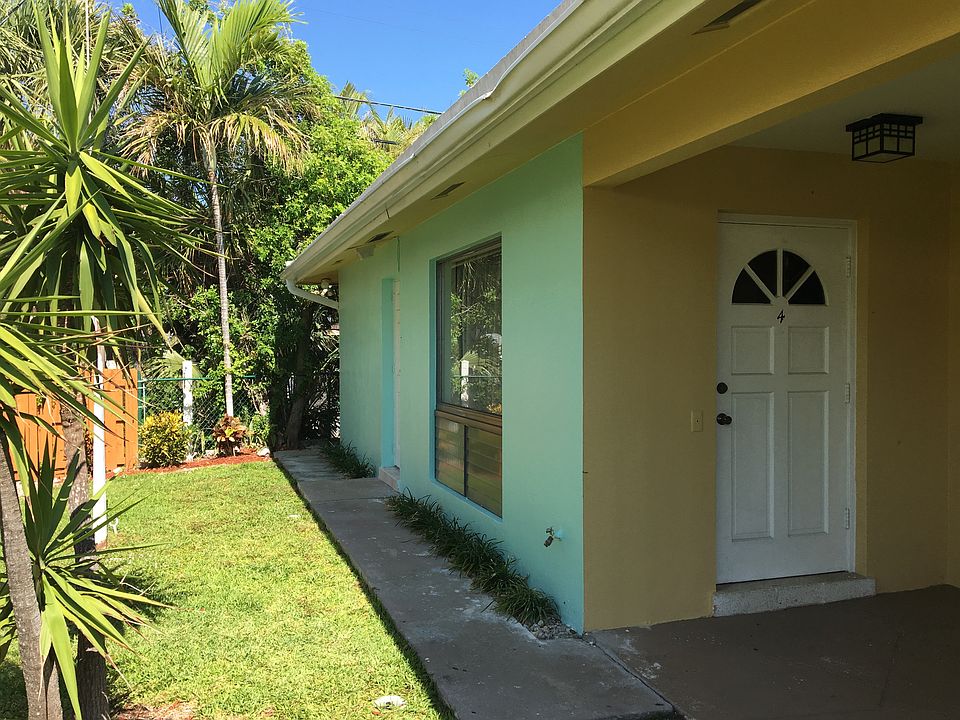 Front door and living room window on left