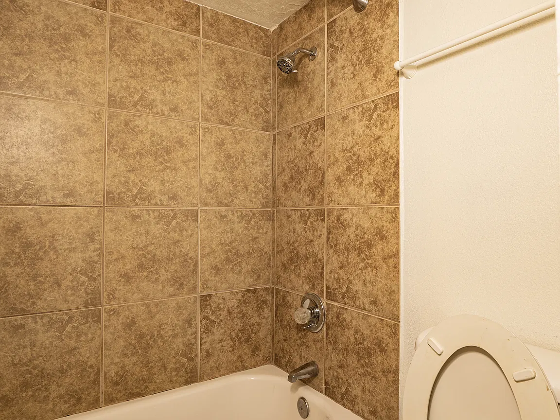 Apartment bathroom — representative home at Fairway Vistas Condominiums.