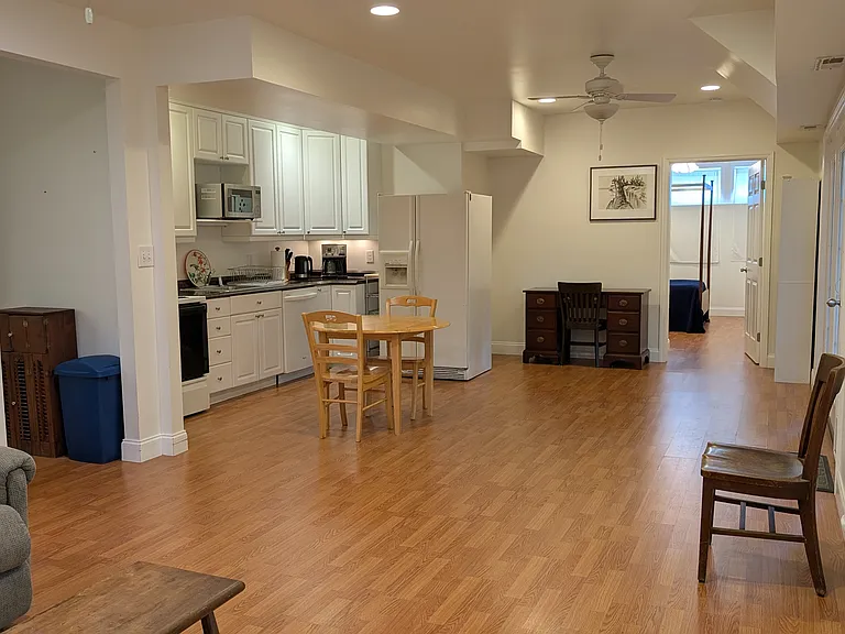From living room to kitchen and dining view into bedroom