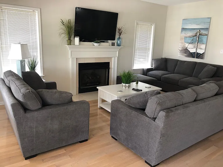 Living room with flat screen TV and fireplace