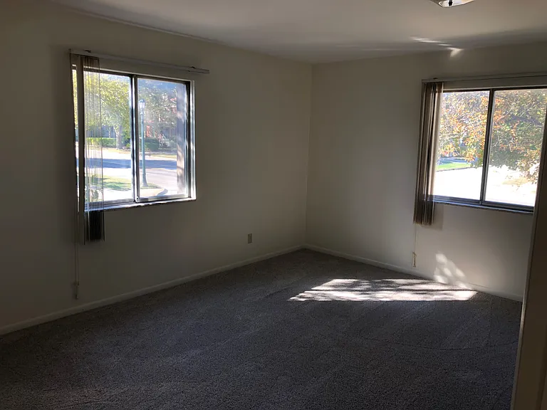 Bedroom 1 windows on two sides of building for cross ventilation and better views of Center Avenue.