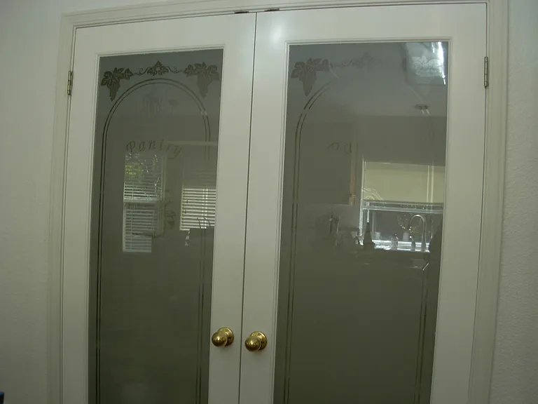 double doors pantry with 5 shelves in kitchen