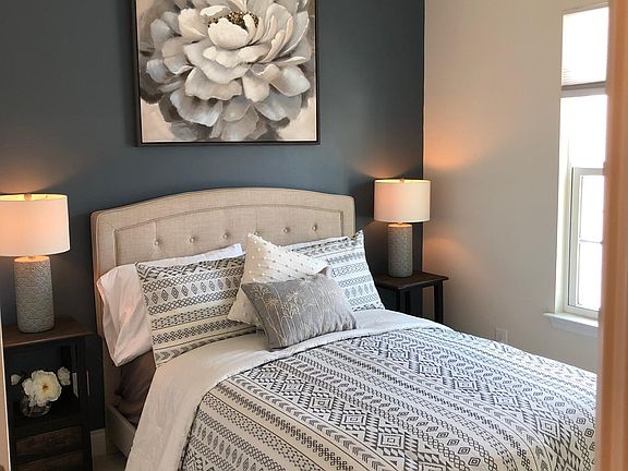 Spare room with full sized bed and closet