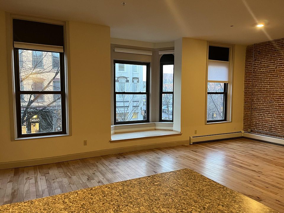 Living room with nook overlooking College Street.