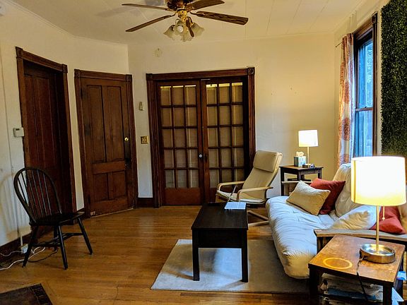 This is a common space. Door in on your front goes to one large bedroom facing westside and the porch. Second door is an entrance/exit to Apt-1. The third door on your far left is another bedroom facing south.