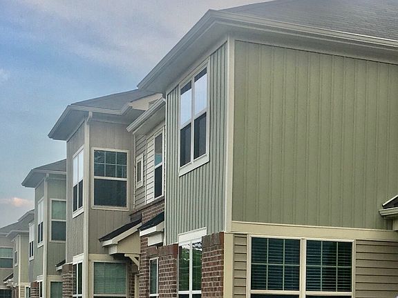 LARGE WINDOWS with SCREENS! Brick facade. Manicured Yard